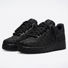Pair of AF1 Custom Black Crystal sneakers viewed from the front with oversized black rope laces